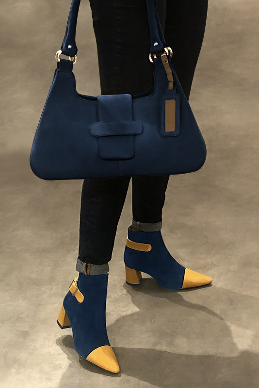 Mustard yellow and navy blue women's ankle boots with buckles at the back. Tapered toe. Medium flare heels. Worn view - Florence KOOIJMAN